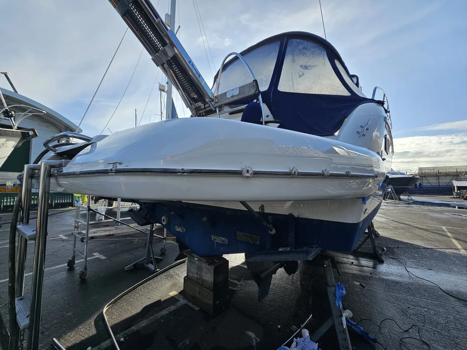 Sports cruiser's stern quarter after gelcoat repair, finished to a full gloss